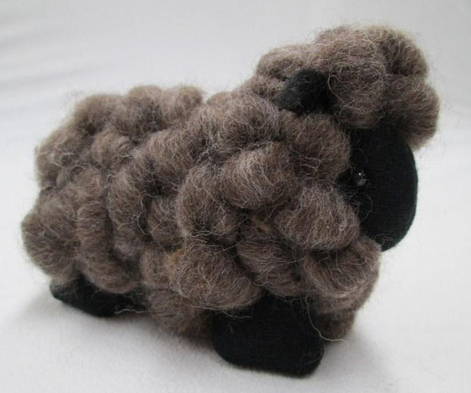 Brown wool toy sheep in New Zealand 