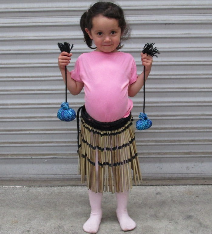 Girl with poi and piupiu in New Zealand