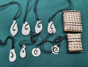 Bone pendants made from beef bone. Maori designs