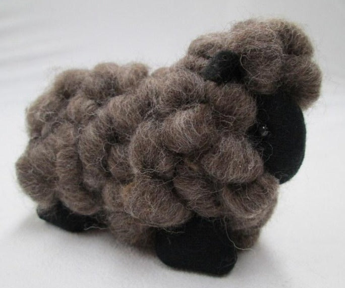 Brown wool toy sheep in New Zealand 